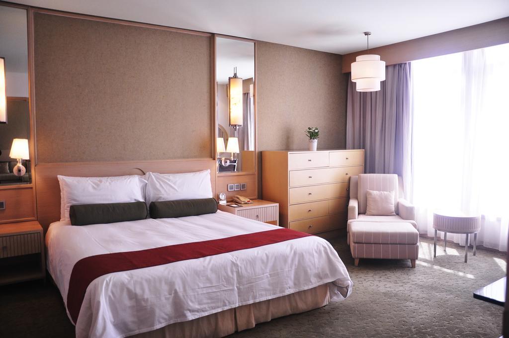 Hotel Nikko เทียนจิน ภายนอก รูปภาพ A bedroom at the hotel